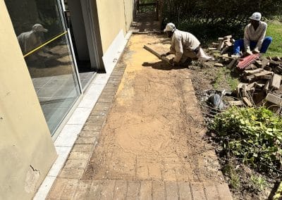 Bricks are removed, cleaned, and laid newly