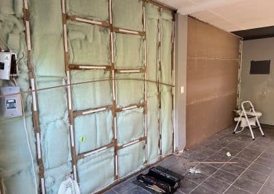 Robert and Thomas sound-proof a wall