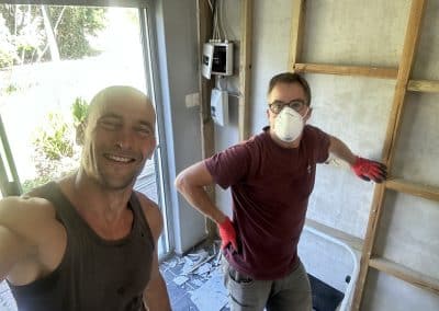 Robert and Thomas sound-proof a wall